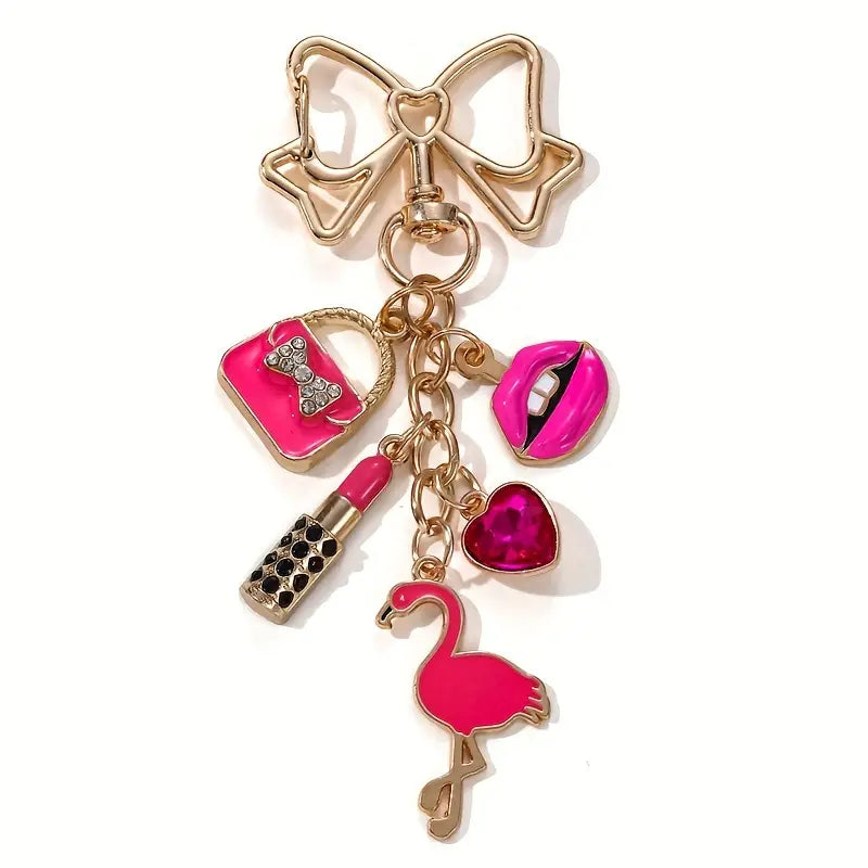 Llavero festivo de flamenco con labial rosa, corazón y lazo dorado: el regalo perfecto para el Día de la Mujer.